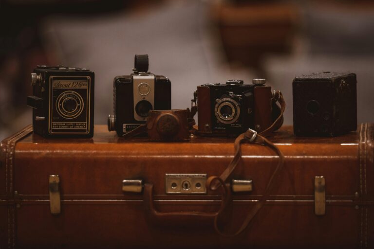 Vintage suitcase with cameras ready for Colombia solo travel adventure